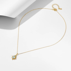 Pear shape sky blue topaz pendant in 925 silver setting on elegant thin gold chain