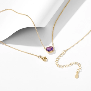 Macro view of 925 silver gold necklace with rectangular amethyst and lobster clasp