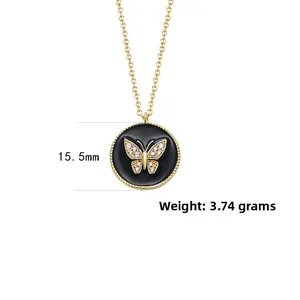 Detail of 15.5mm black round pendant with crystal butterfly and gold chain, weighing 3.74g