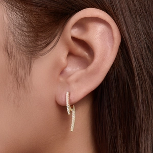 Minimalist gold S925 sterling silver hoop earrings with micro-set zircon on model ear