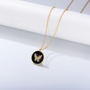 Detail of S925 silver necklace with black enamel pendant and CZ butterfly motif