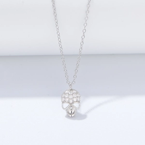 Macro shot of S925 sterling silver skull pendant with pavé cubic zirconia diamonds