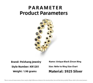 Macro detail of S925 silver ring with black zircon stones and polished gold plating