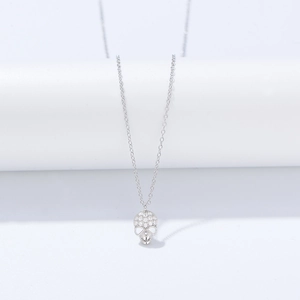 Detailed view of S925 silver skull pendant necklace with sparkling white zircons