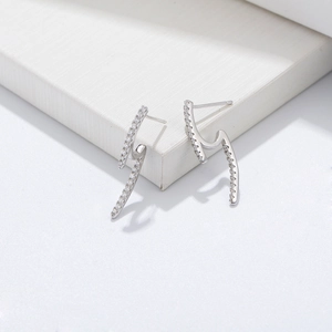 Macro shot of S925 sterling silver lightning earrings with micro-pave zircon crystals
