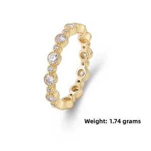 Macro view of gold-plated geometric ring with bezel-set cubic zirconia weighing 1.74g