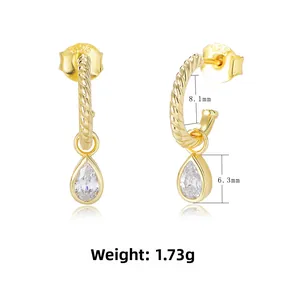 Detail of S925 silver C-shape earrings with twisted texture and pear-cut zircon pendants