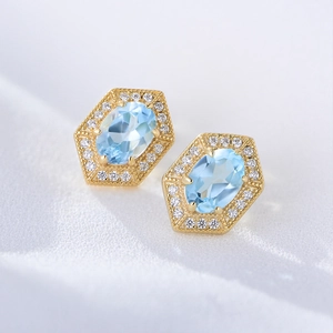 Vintage geometric sterling silver stud earrings with blue topaz and milgrain edges
