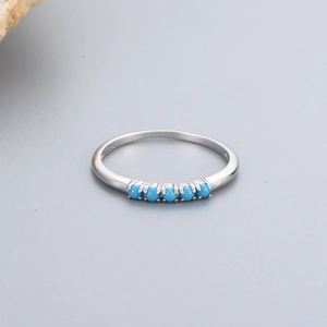 Minimalist S925 sterling silver ring featuring five round turquoise stones in a row