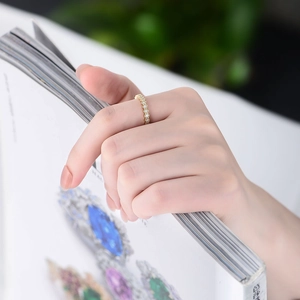 Minimalist S925 silver hexagonal honeycomb ring with white zircon stones on female hand