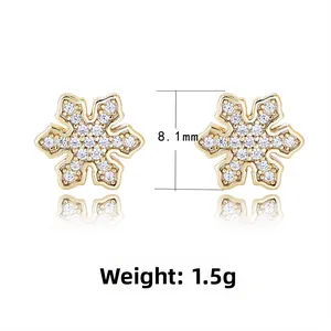 Detail of gold snowflake earrings with zircons, weight 1.5g and height 8.1mm