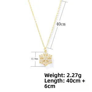 Detail view of gold snowflake necklace with dimensions 12.8mm pendant and 40cm chain