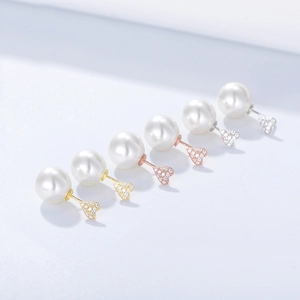 Détails de boucles d'oreilles cœur et perle en argent S925 finitions or et or rose
