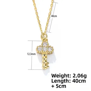 Detail view of gold key necklace showing 12.3mm pendant size and 40cm chain length specs