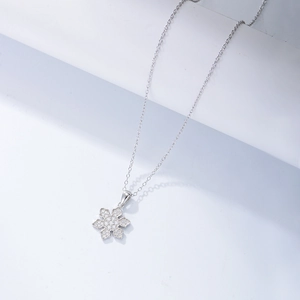 Close-up of S925 silver snowflake pendant necklace with sparkling cubic zirconia stones