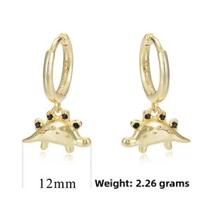 Detail view of gold dinosaur earrings in S925 silver with black stones and 12mm size