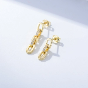 Close-up of S925 sterling silver stamp on vintage chain earrings with zircon inlay