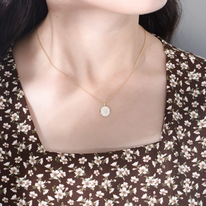 S925 silver gold heart circle pendant necklace worn on neck with floral outfit