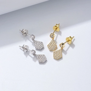 Detail shot of S925 sterling silver stamp on geometric pavé zircon earrings