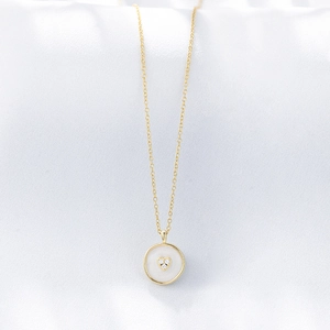 Minimalist s925 silver gold necklace with heart-in-circle pendant on white silk background