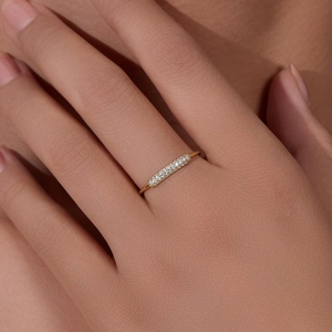 Elegant gold sterling silver ring with micro-set zircons on a minimalist bar setting
