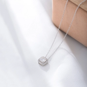 Macro shot of S925 silver square halo pendant with brilliant round cubic zirconia stone