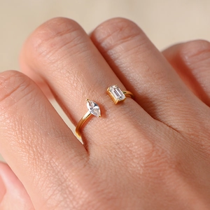 Zircon open silver ring featuring marquise and emerald cut stones in gold finish