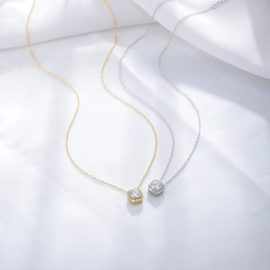 Square halo zirconia pendant necklace in gold and silver finish with silk background