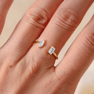 Macro shot of gold zircon wrap ring with marquise and rectangular cut stones