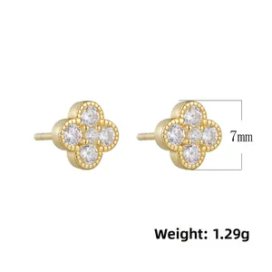 Detail view of 7mm gold clover stud earrings with zircon inlay showing 1.29g weight