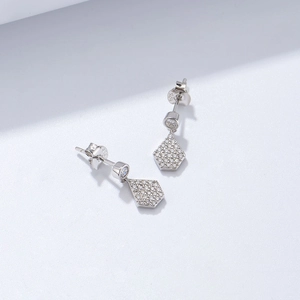 Detailed view of S925 sterling silver stamp on geometric earrings with cubic zirconia