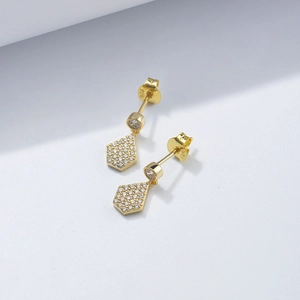 Macro detail of S925 sterling silver geometric earrings with micro-pave cubic zirconia