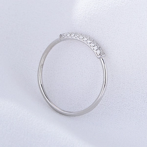 Macro shot of S925 sterling silver ring featuring pave white zircon stones and 925 stamp