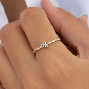 Minimalist gold ring with sparkling zircon stones in a floral design for women
