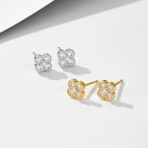 Minimalist 925 sterling silver four-leaf clover stud earrings with sparkling zircons