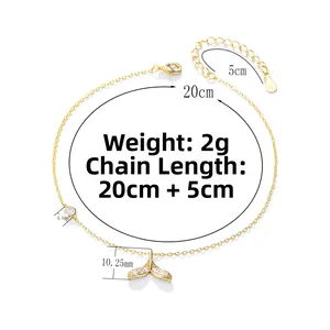 Macro detail of silver mermaid tail anklet with dimensions and zircon inlay details
