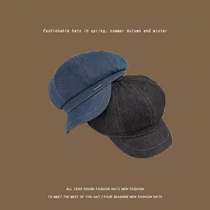 Washed denim octagonal newsboy caps in blue and black colors with metal accents