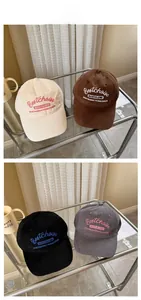 Detail of four colorful baseball caps with premium 3D embroidery on a glass shelf
