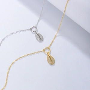 Minimalist shell-shaped anklet with micro-set crystals in gold and silver finishes