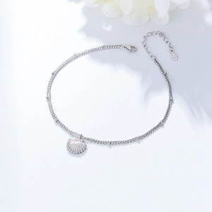 S925 sterling silver layered shell anklet with crystals and adjustable clasp on white back
