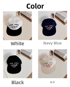 Detail view of four-color retro baseball caps with Native Forest mountain embroidery