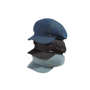 Three-color washed denim newsboy caps with metal tags for women in a stackable view