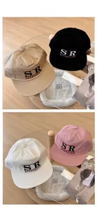 Flat brim baseball cap details showing SR AFTERGLOW embroidery in four colors
