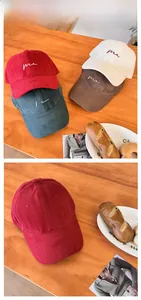 Detail of vintage cotton baseball cap with me embroidery and various color options