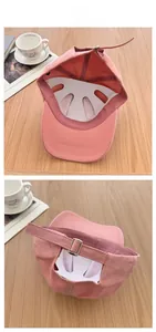 Détails d'une casquette en coton rose avec boucle métallique réglable et structure intérieure