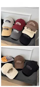 Close-up of distressed baseball caps featuring OUTSTAND embroidery and worn-out details