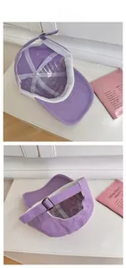 Detail view of purple baseball cap interior seams and adjustable metal buckle strap
