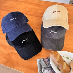 Navy, black, beige, and gray embroidered cotton baseball caps with a wide curved brim