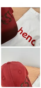 Macro detail of wine red baseball cap featuring premium cotton texture and embroidery