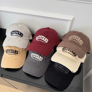 Vintage distressed baseball caps with Outstand embroidery in six retro colors